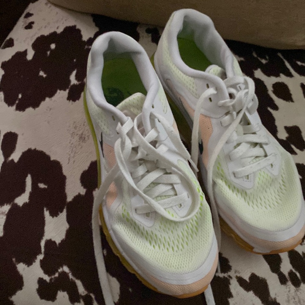 White, orange and lime green Nike running shoes
